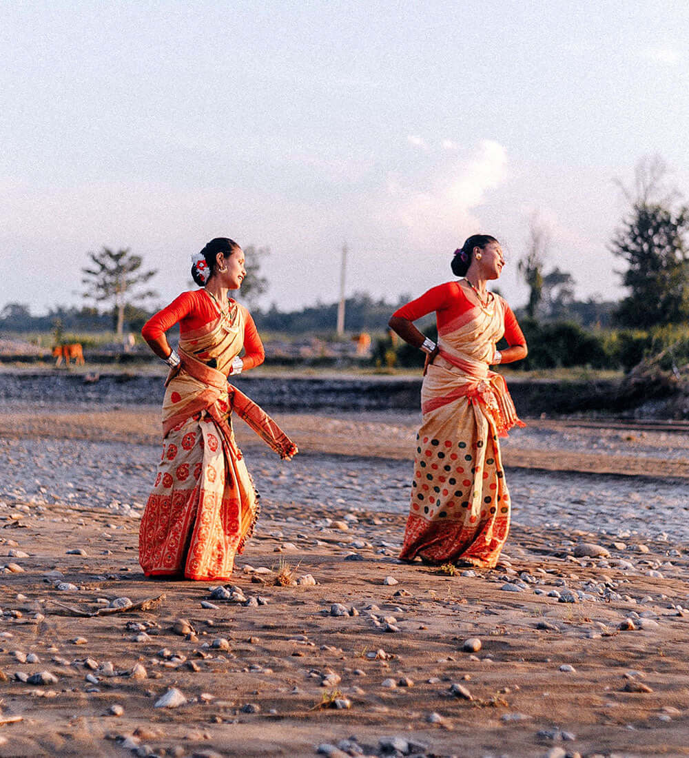 two women dancing bihu