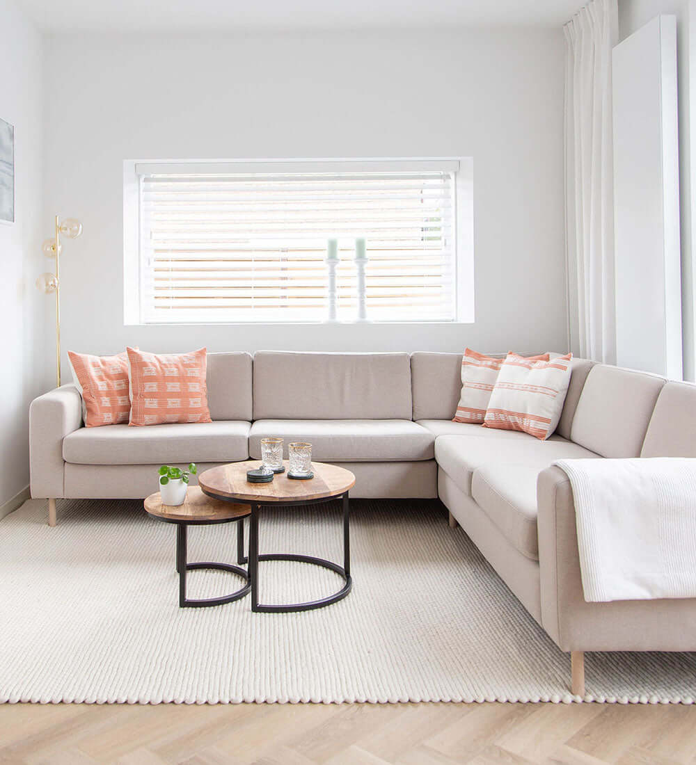 four cushions kept on a sofa