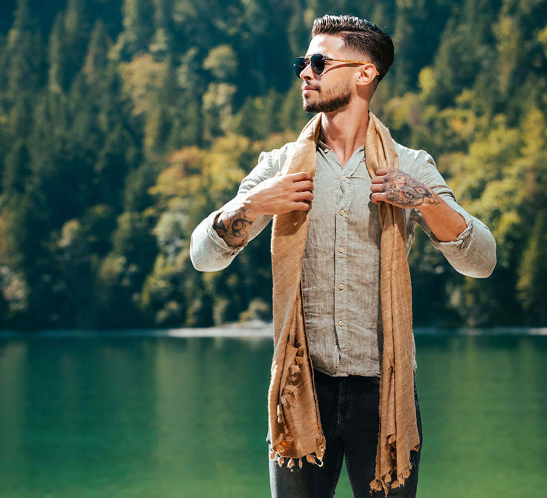 man wrapped up in a beige stole