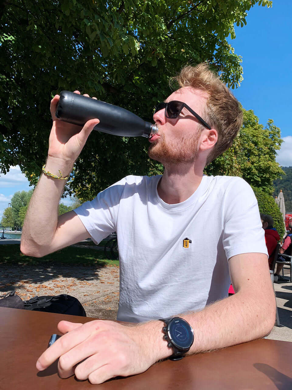 man drinking from a bottle