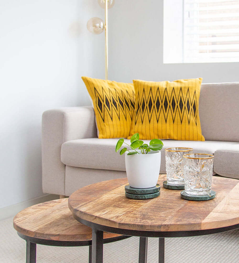 two naga cushions on a white sofa