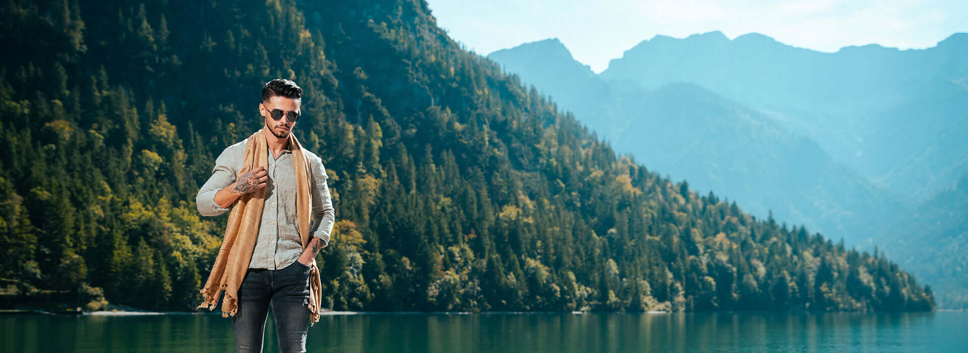 man wrapped up near mountains