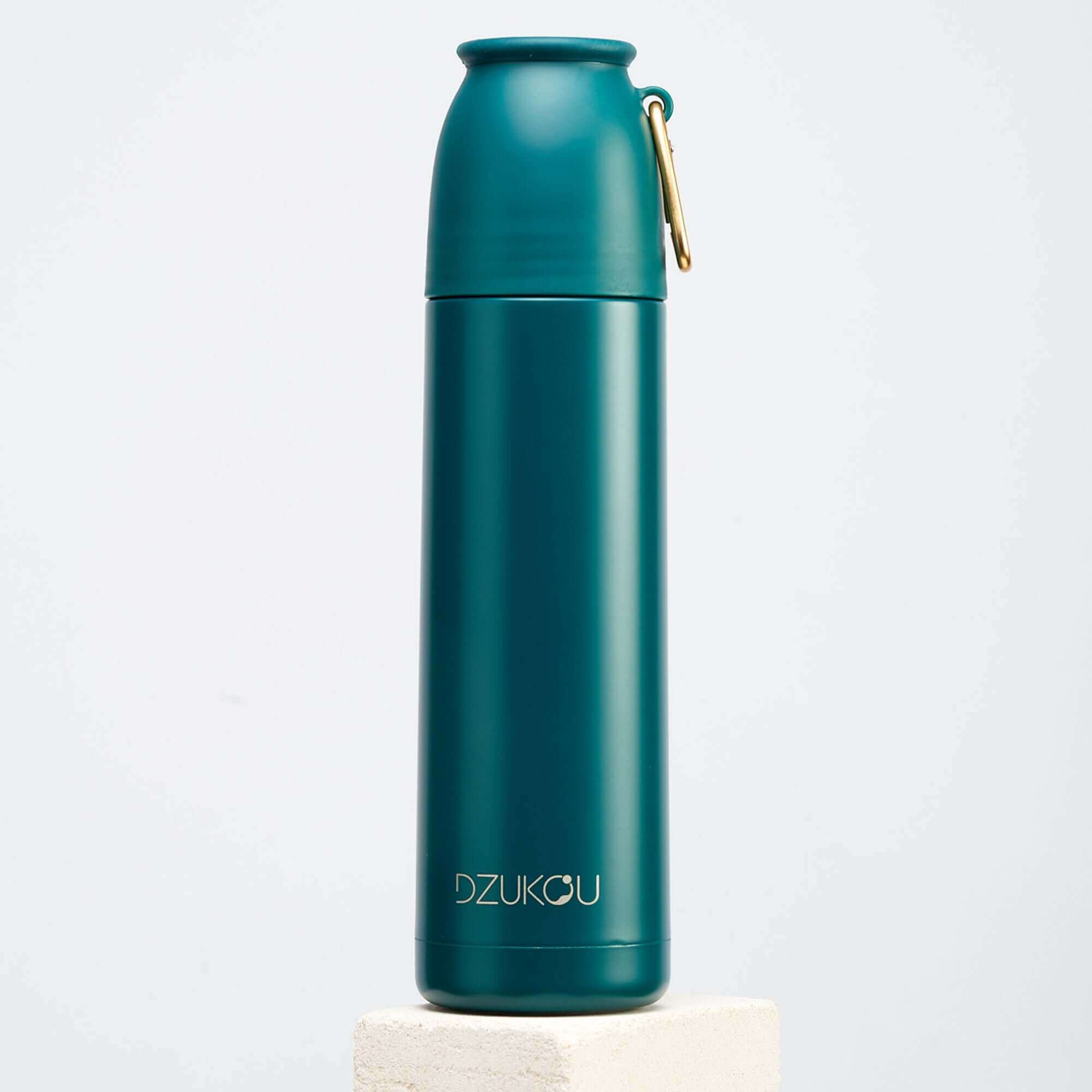 A teal stainless steel thermos flask featuring a stylish gold handle, perfect for hydration on the go.