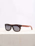 A wooden sunglasses featuring a stylish wooden frame in a clean surface with a neutral background, showcasing a unique and eco-friendly design.