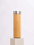 A bamboo water bottle displayed against a clean white background, highlighting its natural texture and eco-friendly design.