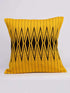 A yellow pillow cover featuring a black and white geometric pattern, adding a modern touch to any decor.