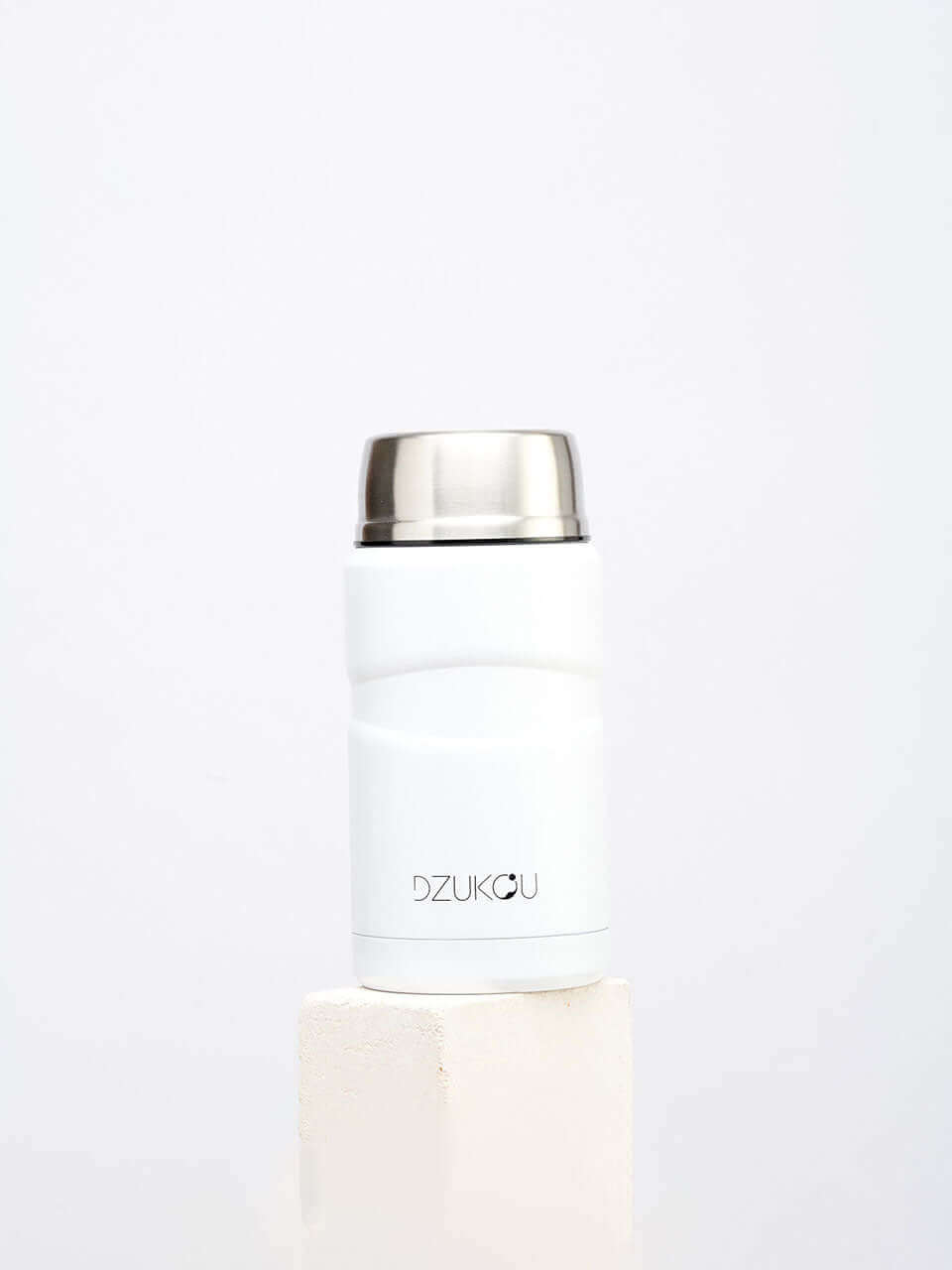 A white thermos lunchpot with a lid, designed for keeping beverages hot or cold, placed on a neutral background.