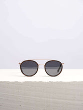 Stylish Wooden Sunglasses kept on a white table