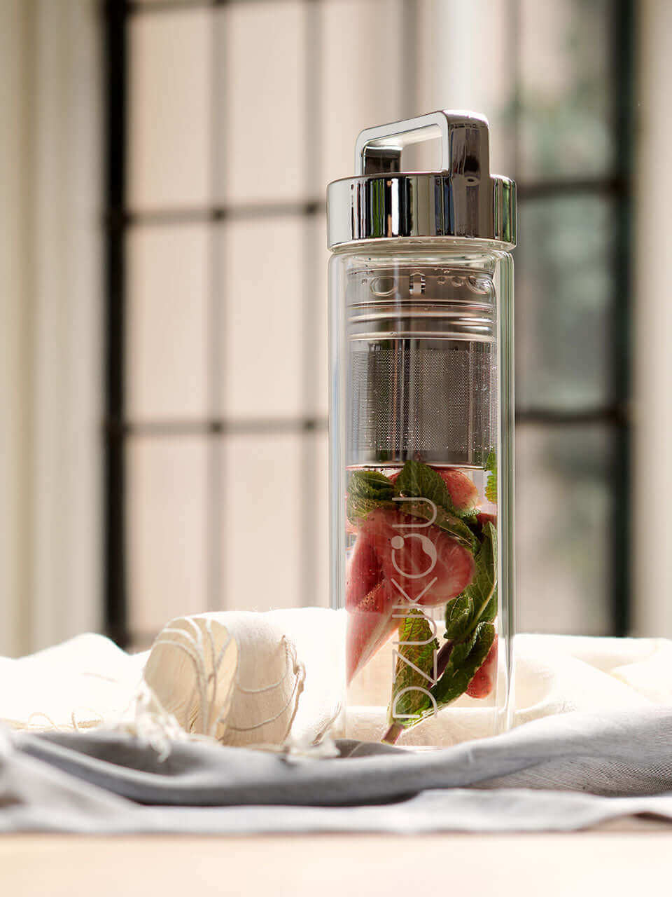 A clear glass bottle, showcasing a refreshing beverage ready to be enjoyed.