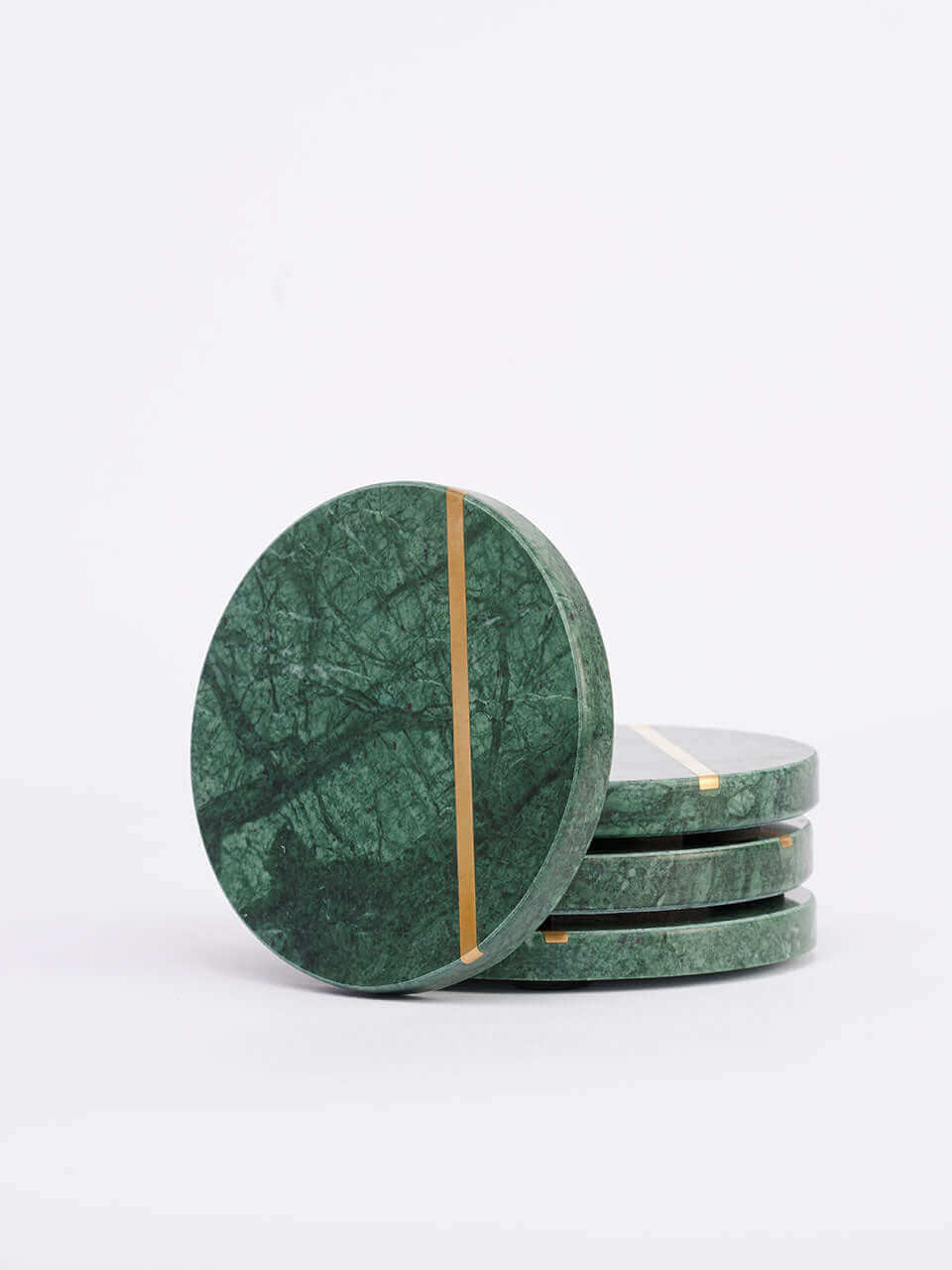 Green marble coasters featuring elegant gold stripes, adding a touch of sophistication to any table setting.