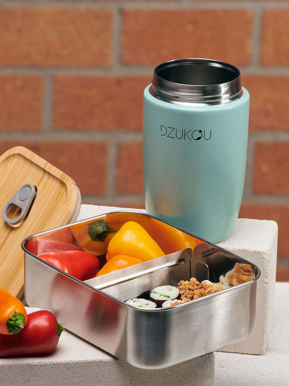 A bamboo lunch box with a bamboo lunchpot, elegantly designed for convenient and eco-friendly dining on the go.