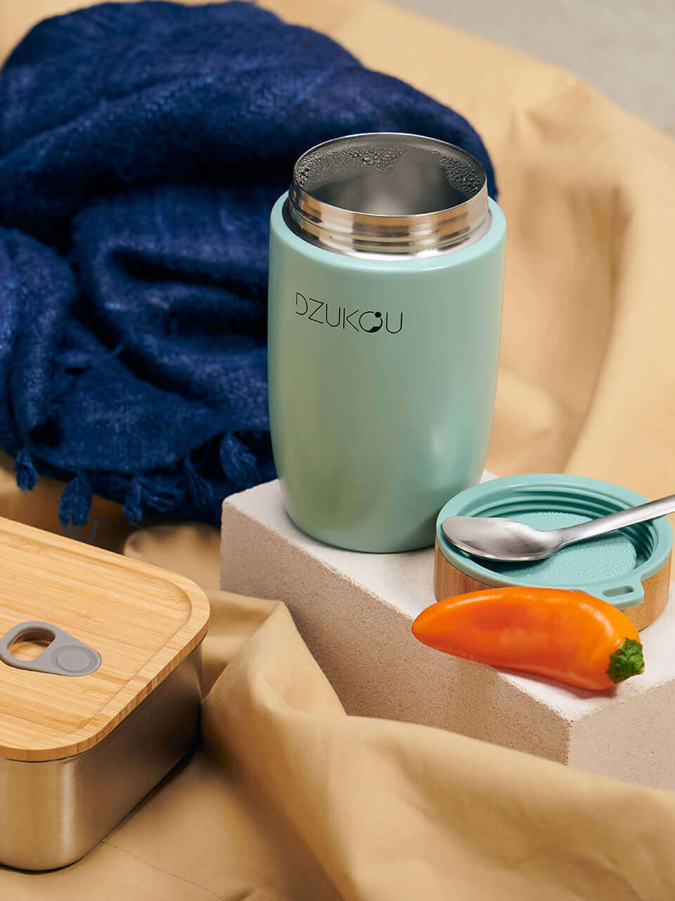 A bamboo lunch box with a bamboo lunchpot, elegantly designed for convenient and eco-friendly dining on the go.