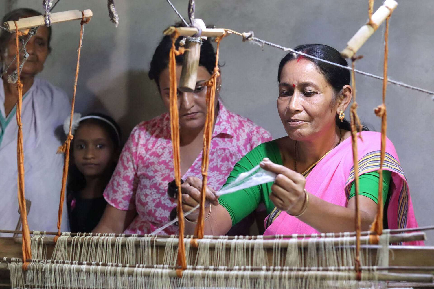 women working on handloom