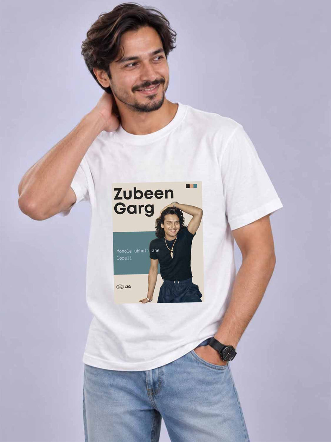 A man wearing a white graphic t-shirt with a &