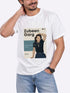 A man wearing a white graphic t-shirt with a &