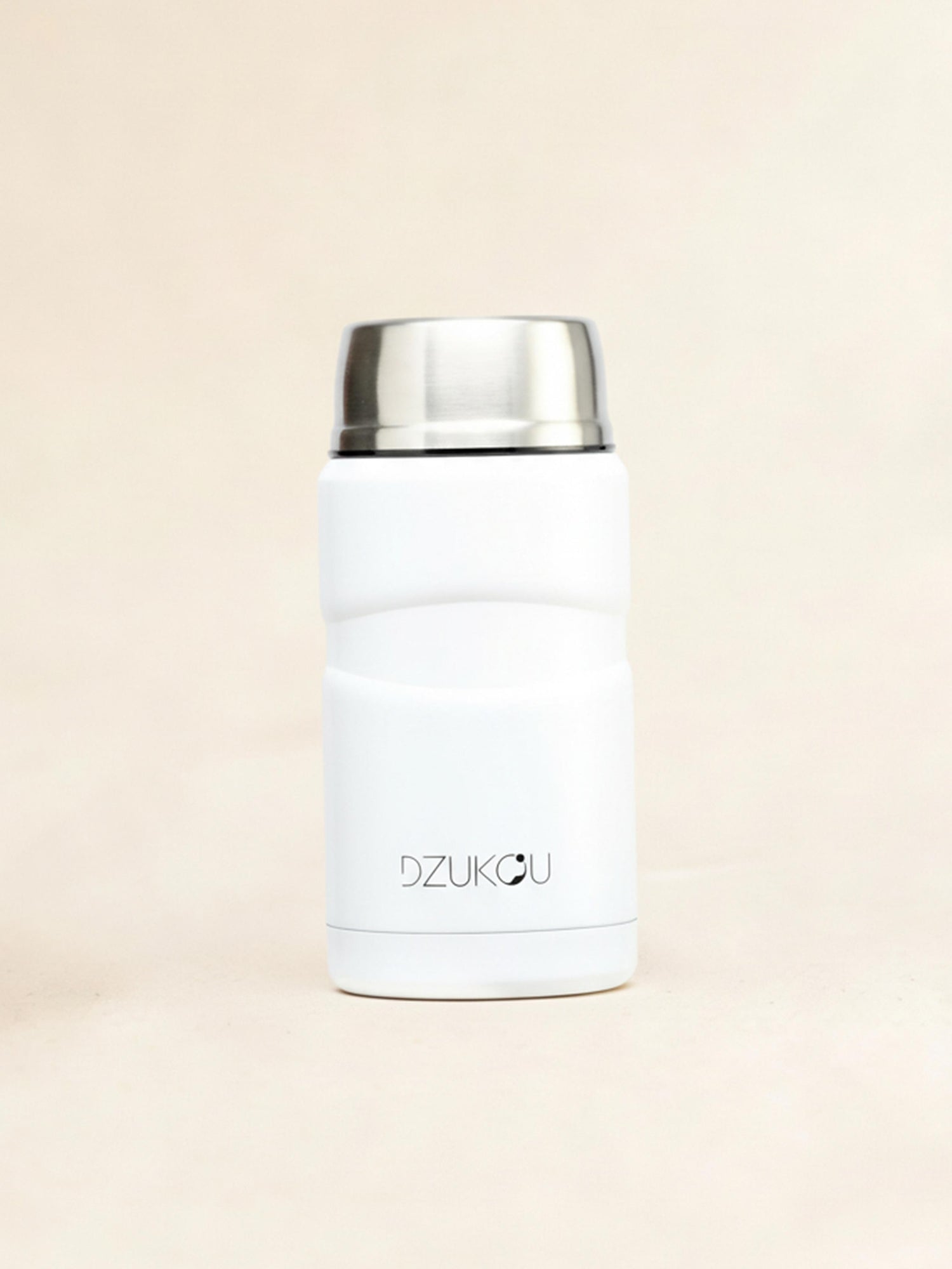 White thermos with silver lid on a beige background