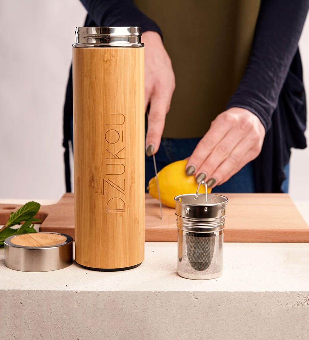 a bamboo bottle with a infuser