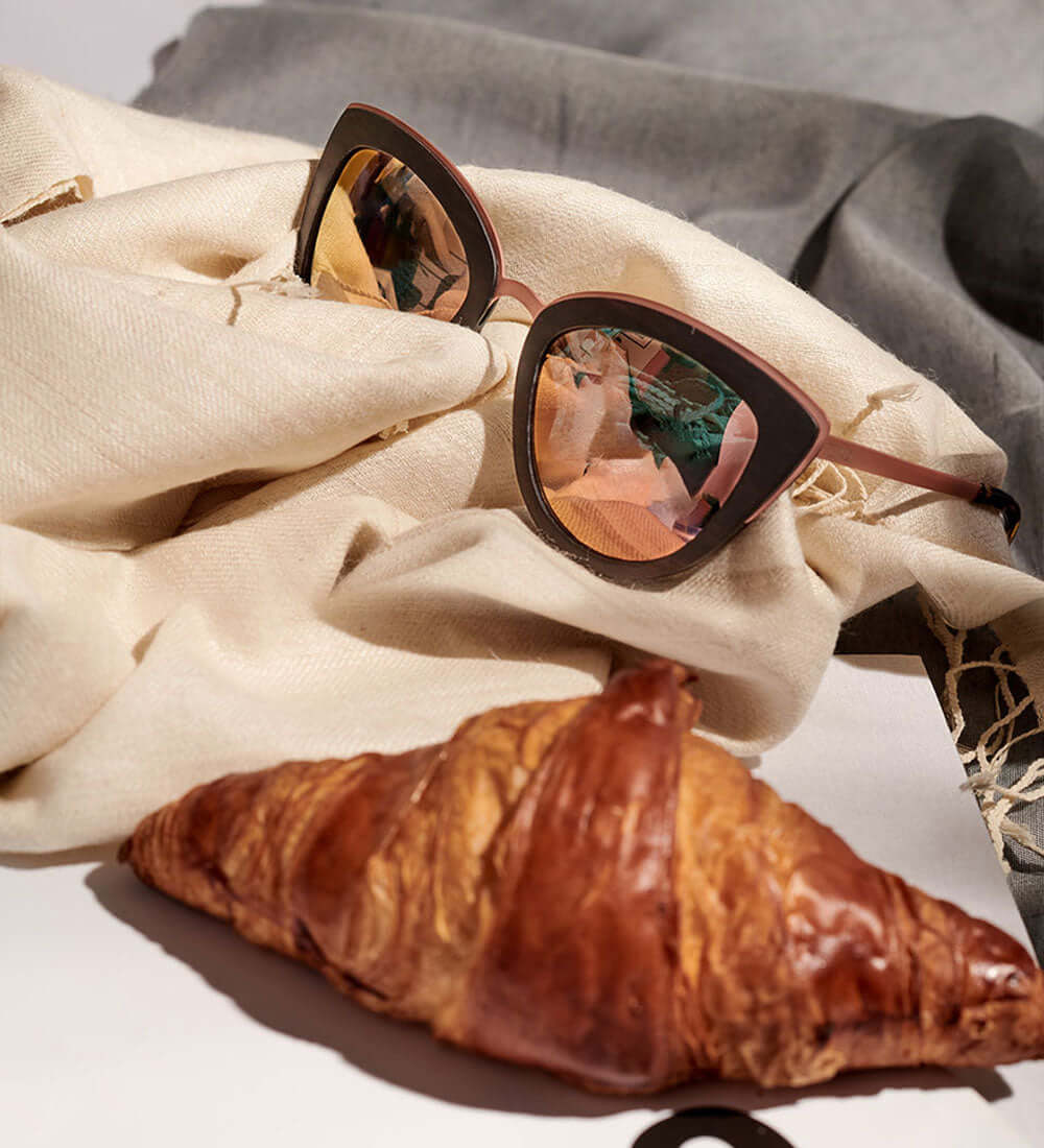 stylish sunglasses and a croissant