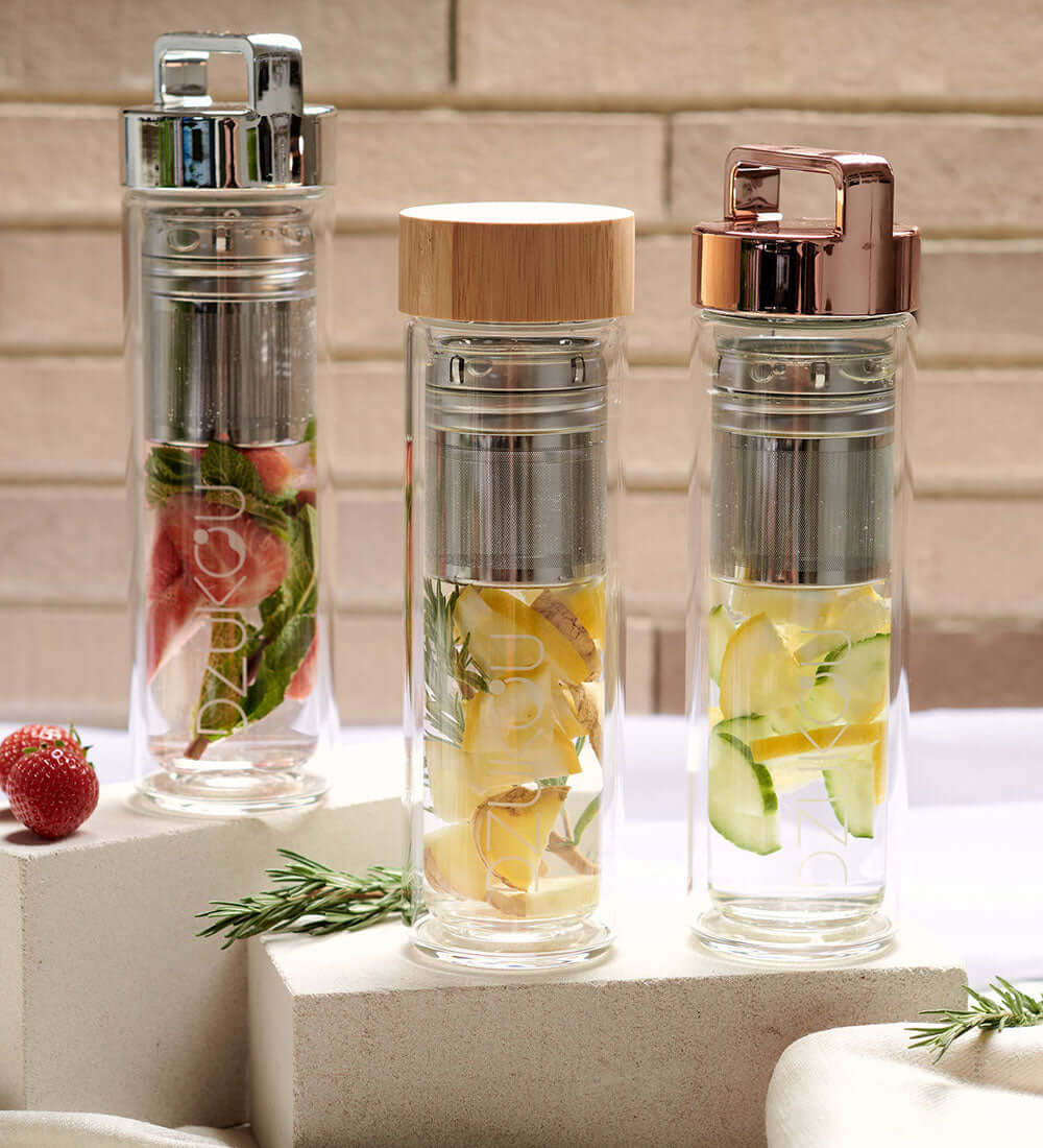 three glass bottles with infusers