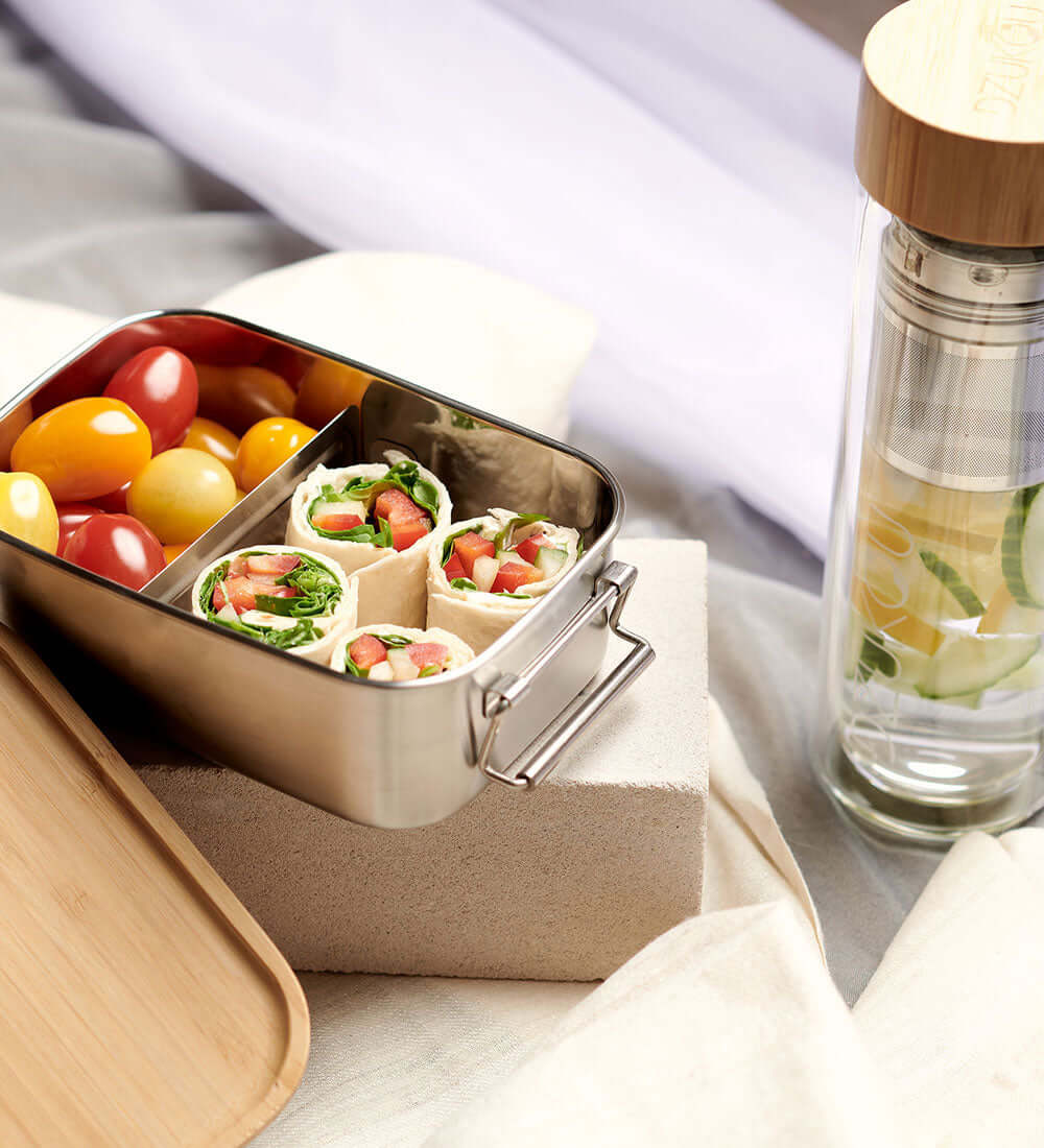 a healthy tiffin box with a bamboo lid bottle
