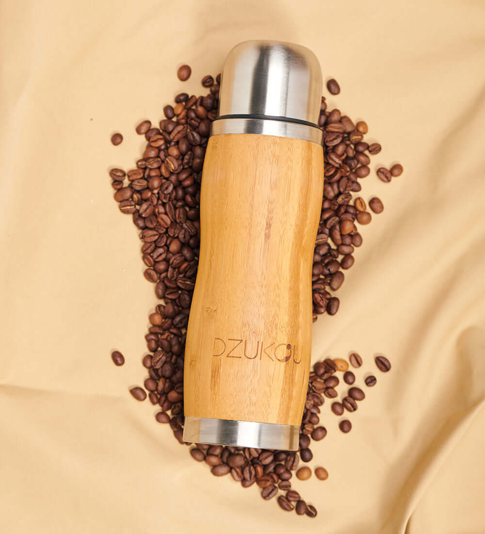 Flask lying on a sheet of coffee beans