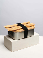 Bamboo tiffin with black band on a white platform