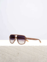 wooden sunglasses on white platform