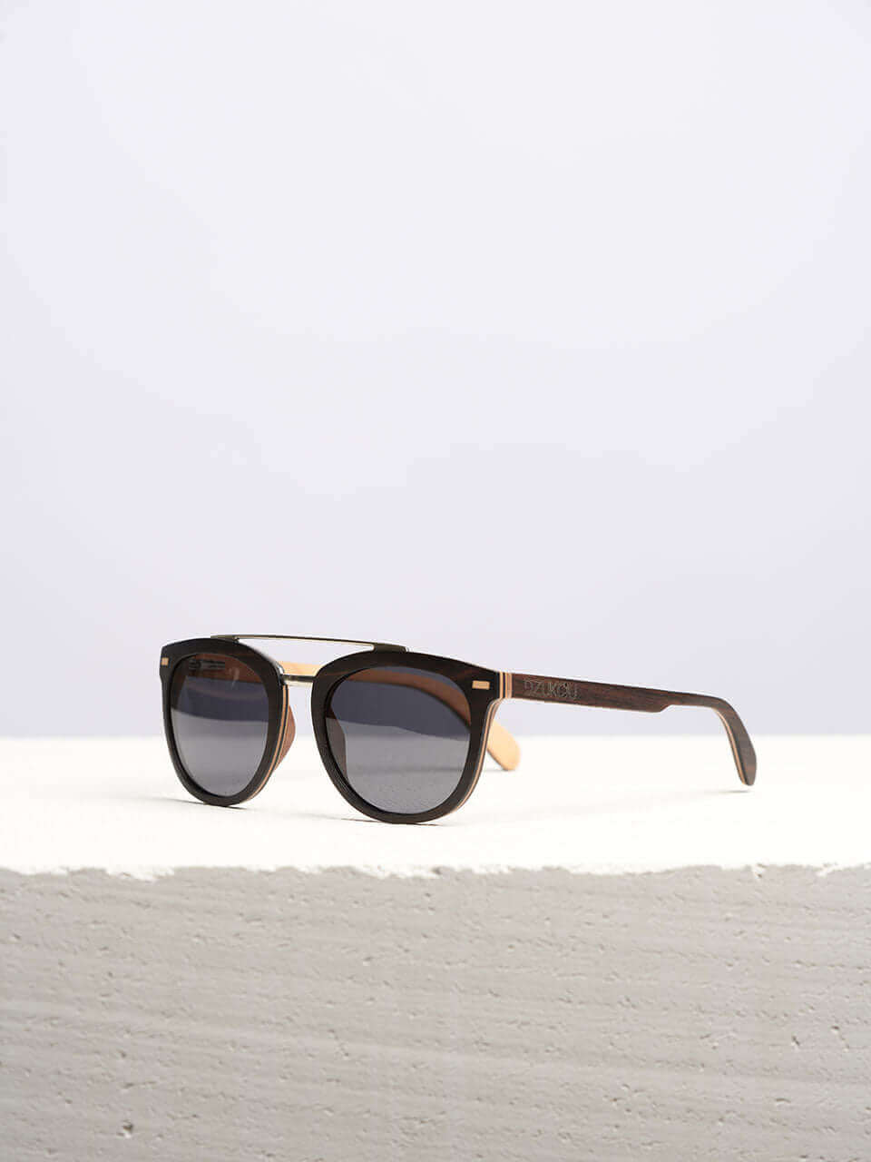 stylish sunglasses kept on a white platform