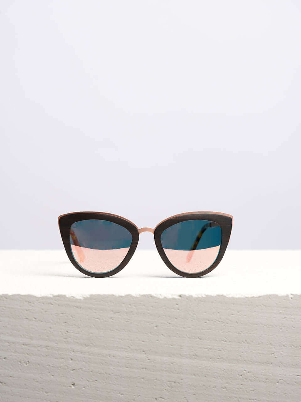 Wooden Sunglasses kept on a white platform